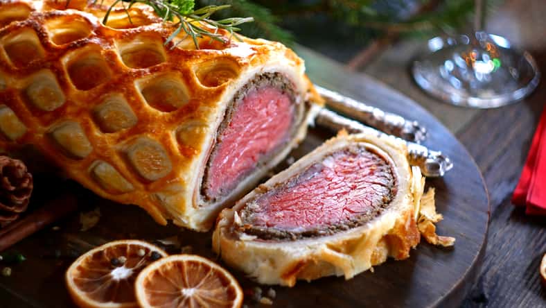 Beef Wellington - a fillet of beef tenderloin steak wrapped in puff pastry. Selective focus