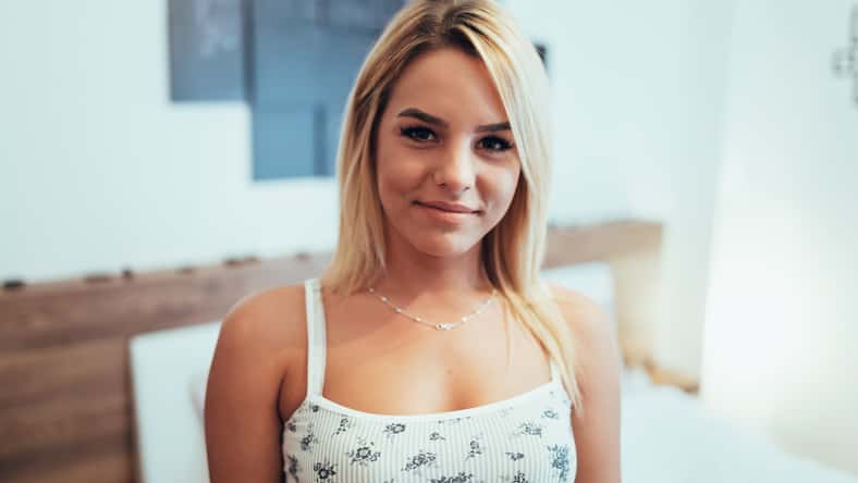 Portrait of a beautiful blonde in bedroom
