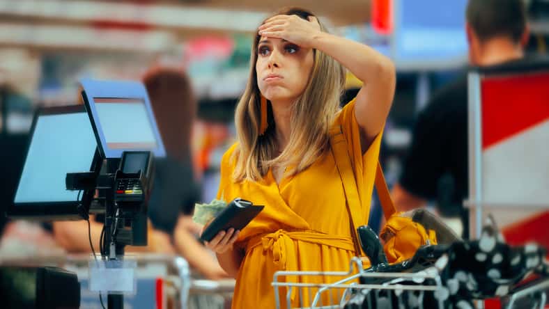 woman checking out grocery store