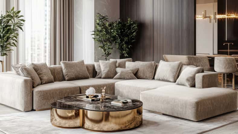 Modern beige sectional sofa with marble coffee table in luxury living room.