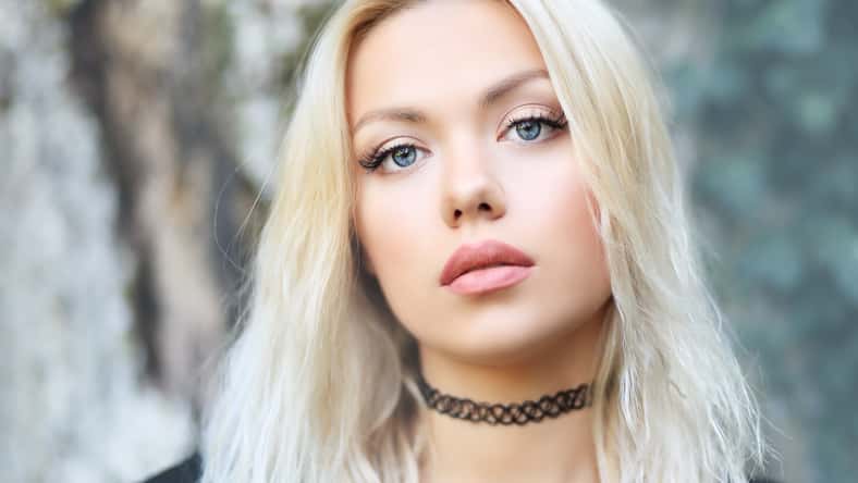 portrait of beautiful blond woman outdoor face close up