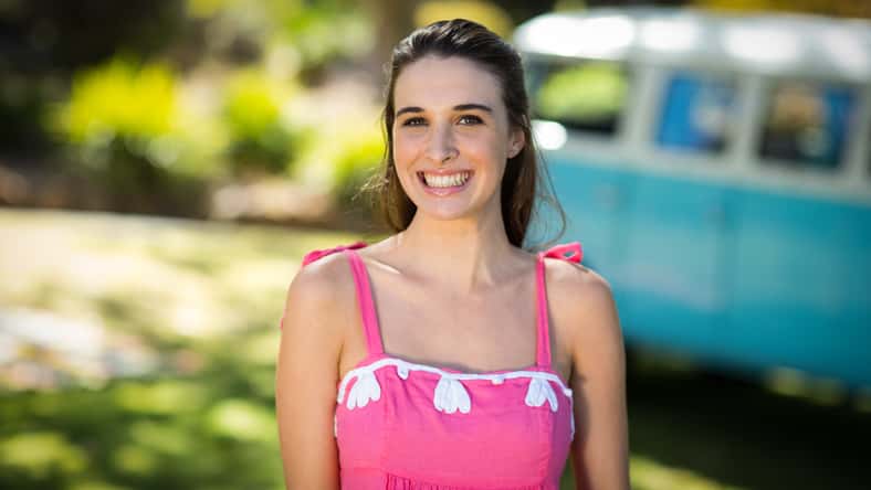 Smiling woman standing in park