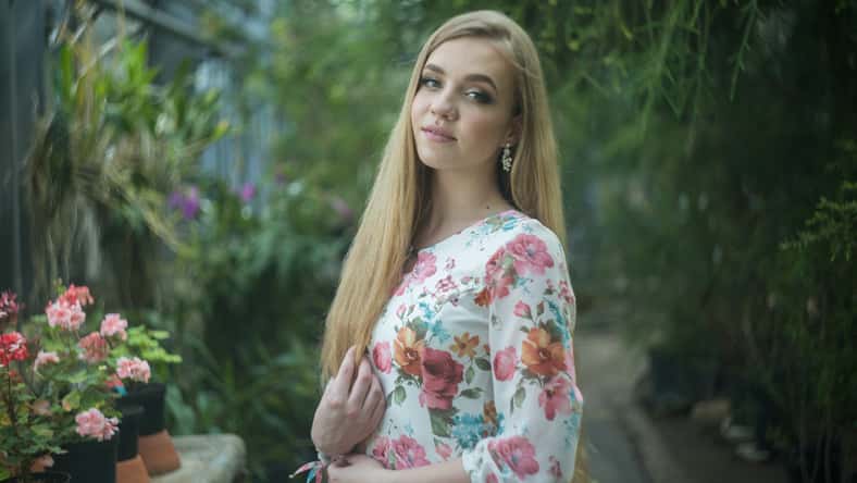 blonde woman portrait in greenhouse