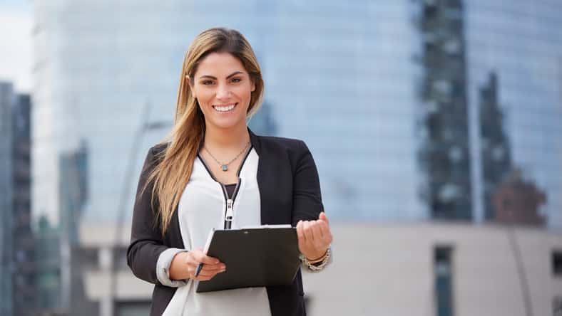 portrait of a professional business woman smiling outdoor