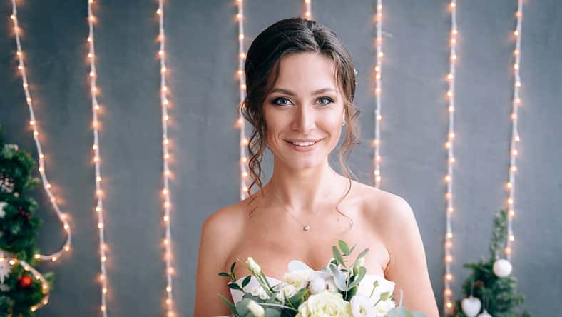 happy and young bride in a gentle dress in eco style.