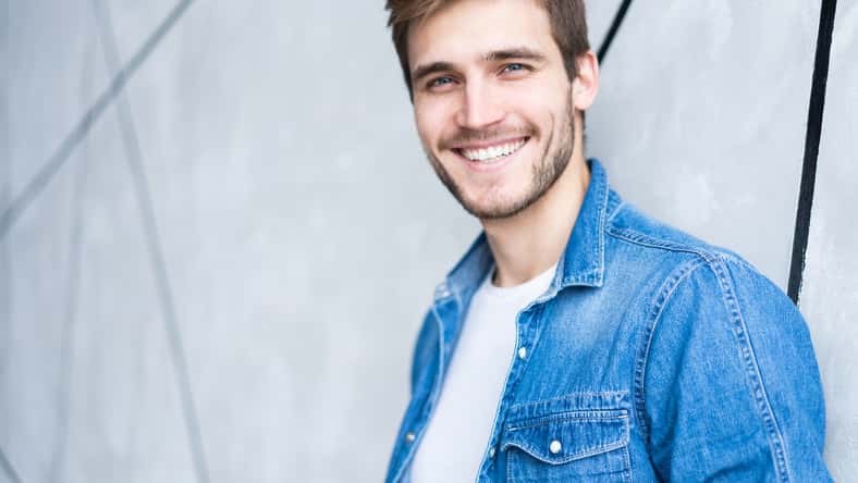 Perfect man. Portrait of happy fashionable handsome man in jeans shirt