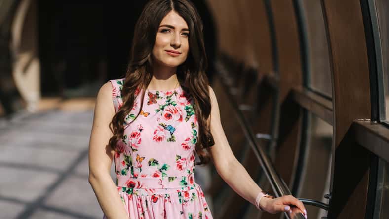 Portrait of beautiful young girl in flower dress with fashion makeup.