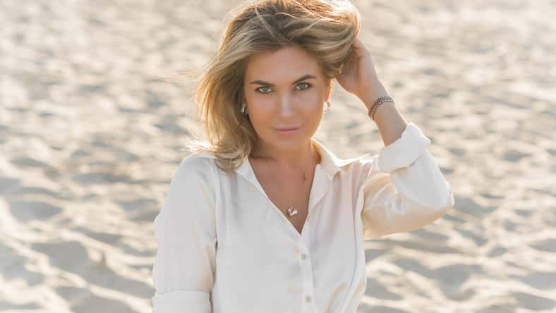 Relax time, elegant woman rest at beach. Nice femininity blonde hair lady, tranquility and freedom concept