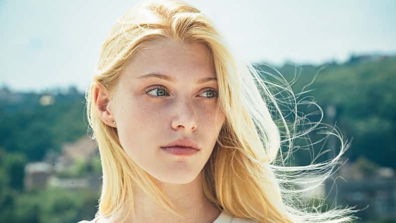 Portrait of young blonde woman outdoor. Romantic girl with beauty face