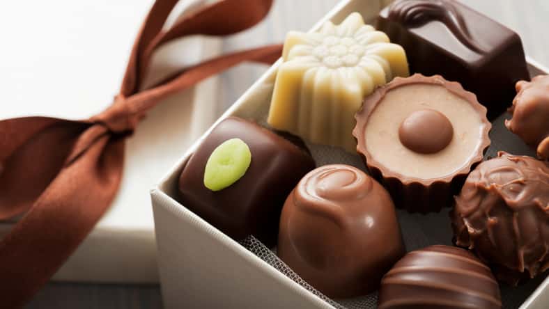 assorted chocolates confectionery in their gift box, close up
