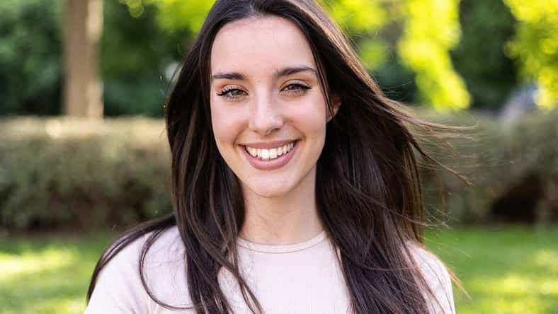 Young beautiful caucasian woman smiling at camera