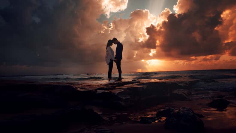 Couple in love at a fiery sunset.Silhouette photo