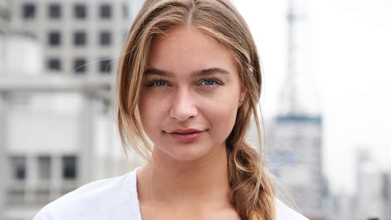 Pretty young woman in city, portrait