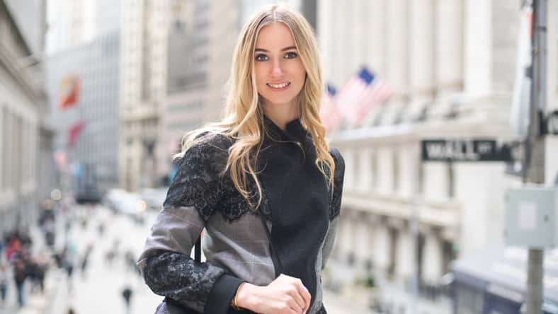 Beautiful elegant lawyer business woman smiling and walking to the court with a bag on a city street