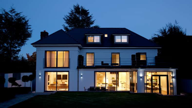 Modern house illuminated at night