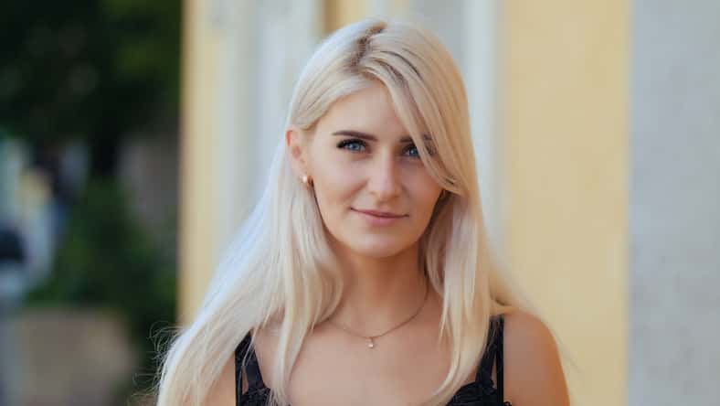 Portrait young attractive smile woman look at camera at city feel happy fashion girl summer face technology sun beautiful.