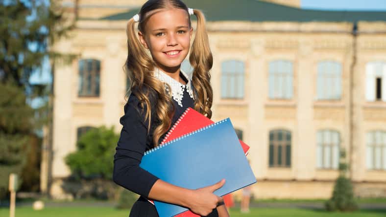 Perfect girl school student uniform hold books, september concept.