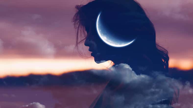 Beautiful woman profile silhouette portrait with moon in her head.