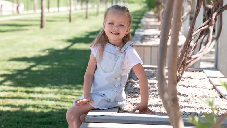green park. Little girl smiles at the camera. girl is 5 years old. Krasnodar Park