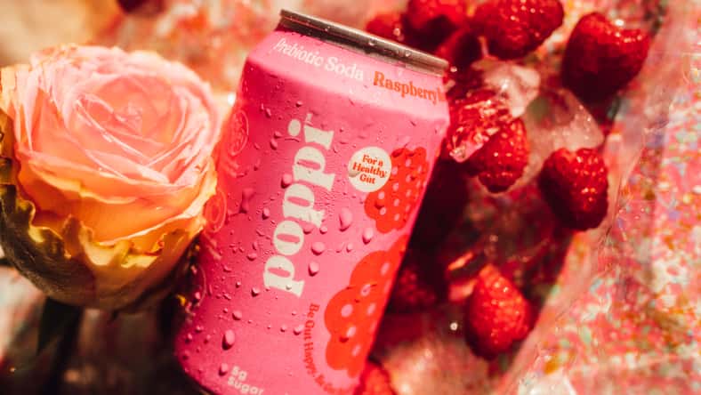 pink 12 oz can of Poppi Prebiotic Soda Raspberry Rose