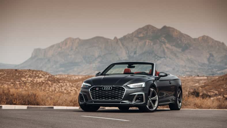Audi S5 Convertible at the parking in front of desert and mountains