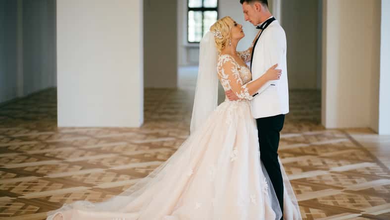 The bride and groom hugging