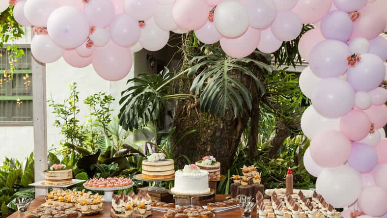 Table with sweets, desserts and cakes, decorated table for reception.