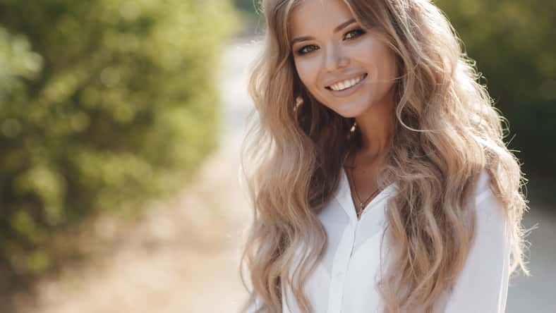 Portrait of a happy beautiful woman in glasses outdoor. High quality photo