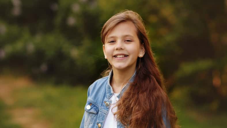 portrait of happy girl in spring day outdoors