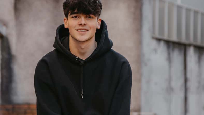 portrait of smiling teenager on the street outdoors