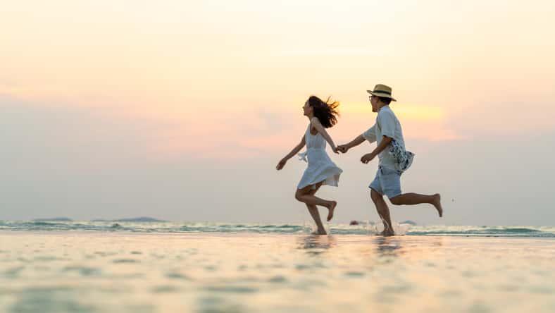 Happy Asian family couple walking and playing