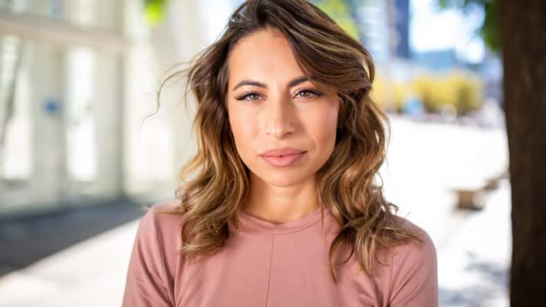 Close up portrait young woman with serious face expression