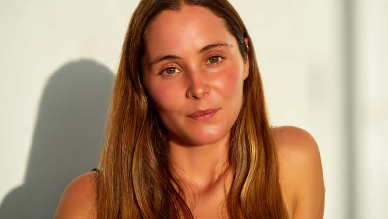 head shot portrait beautiful caucasian woman against white wall