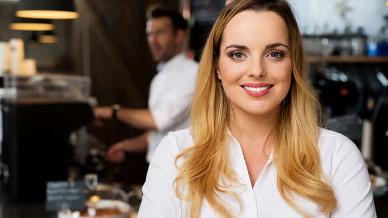 Portrait of happy small business, restaurant owner
