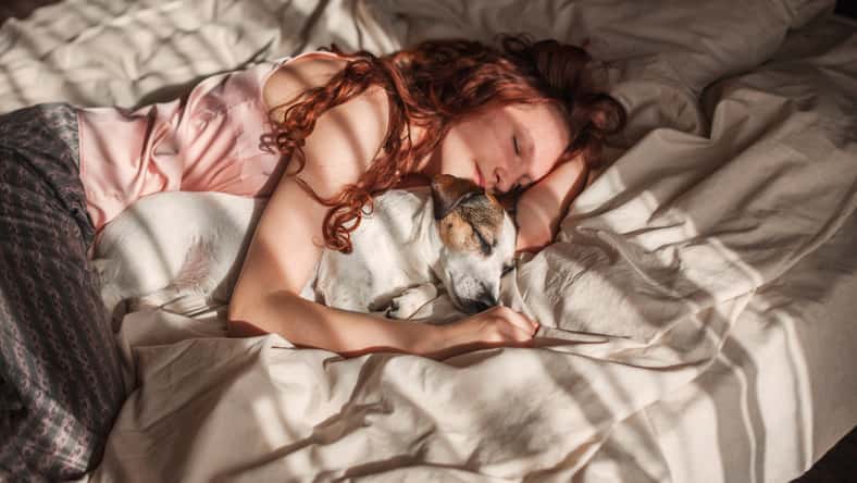 Young woman is lying and sleeping with