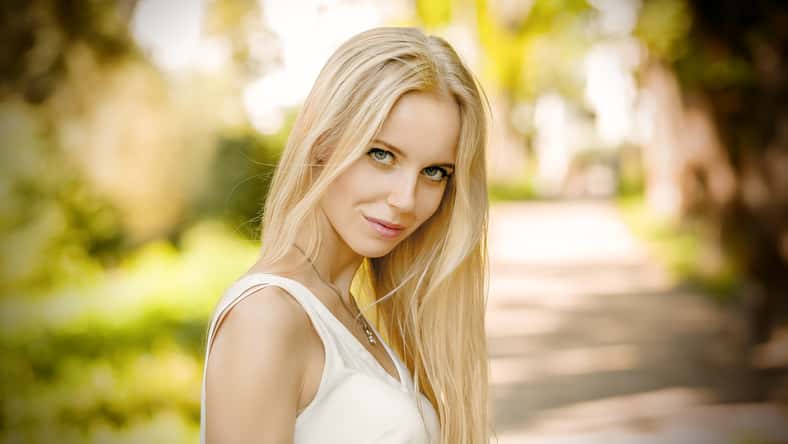 beautiful blond woman looking at camera outdoor