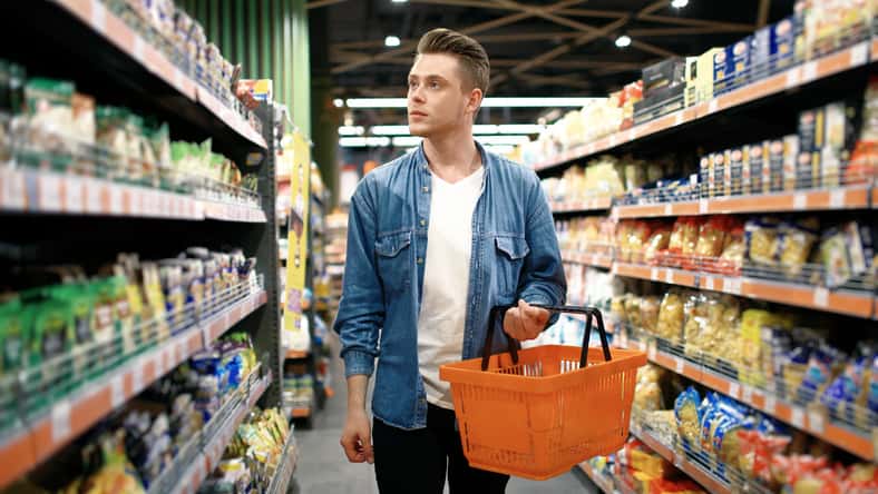 a young man chooses foods at the