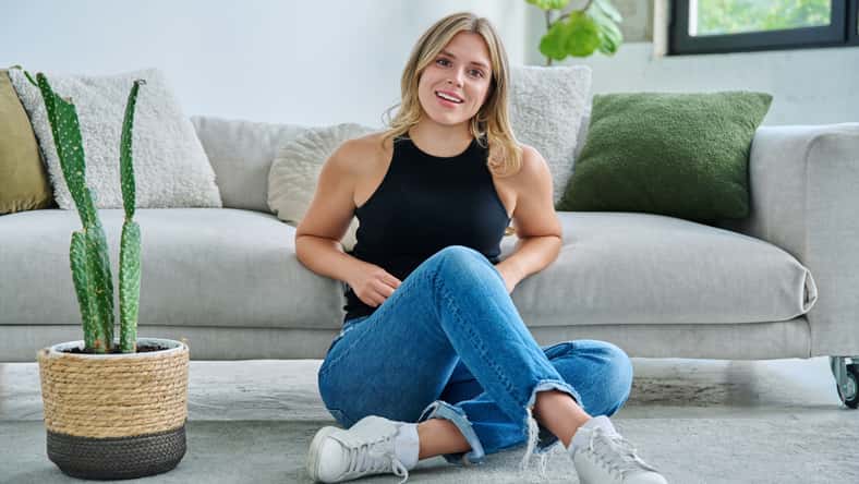 Portrait of relaxed beautiful young woman sitting