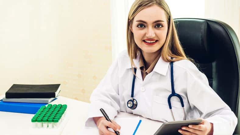 Female doctor and stethoscope working with computer