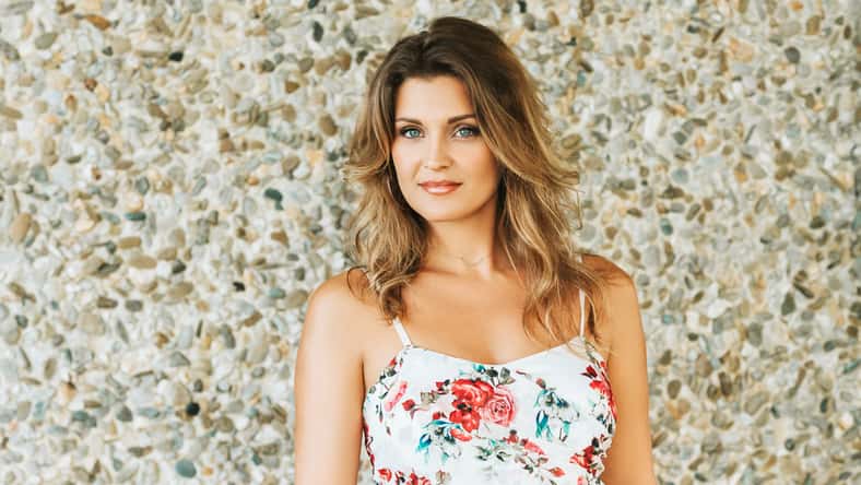 Outdoor portrait of beautiful woman wearing floral