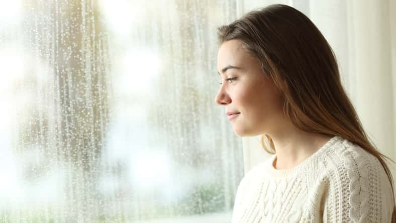 Side view portrait of a happy pensive