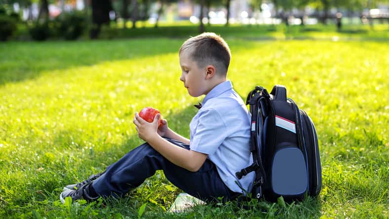 charming blond boy 6 years old in
