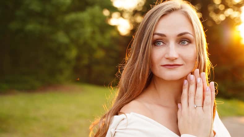 Beautiful calm girl outdoors. Summer woman portrait