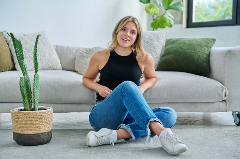 Portrait of relaxed beautiful young woman sitting