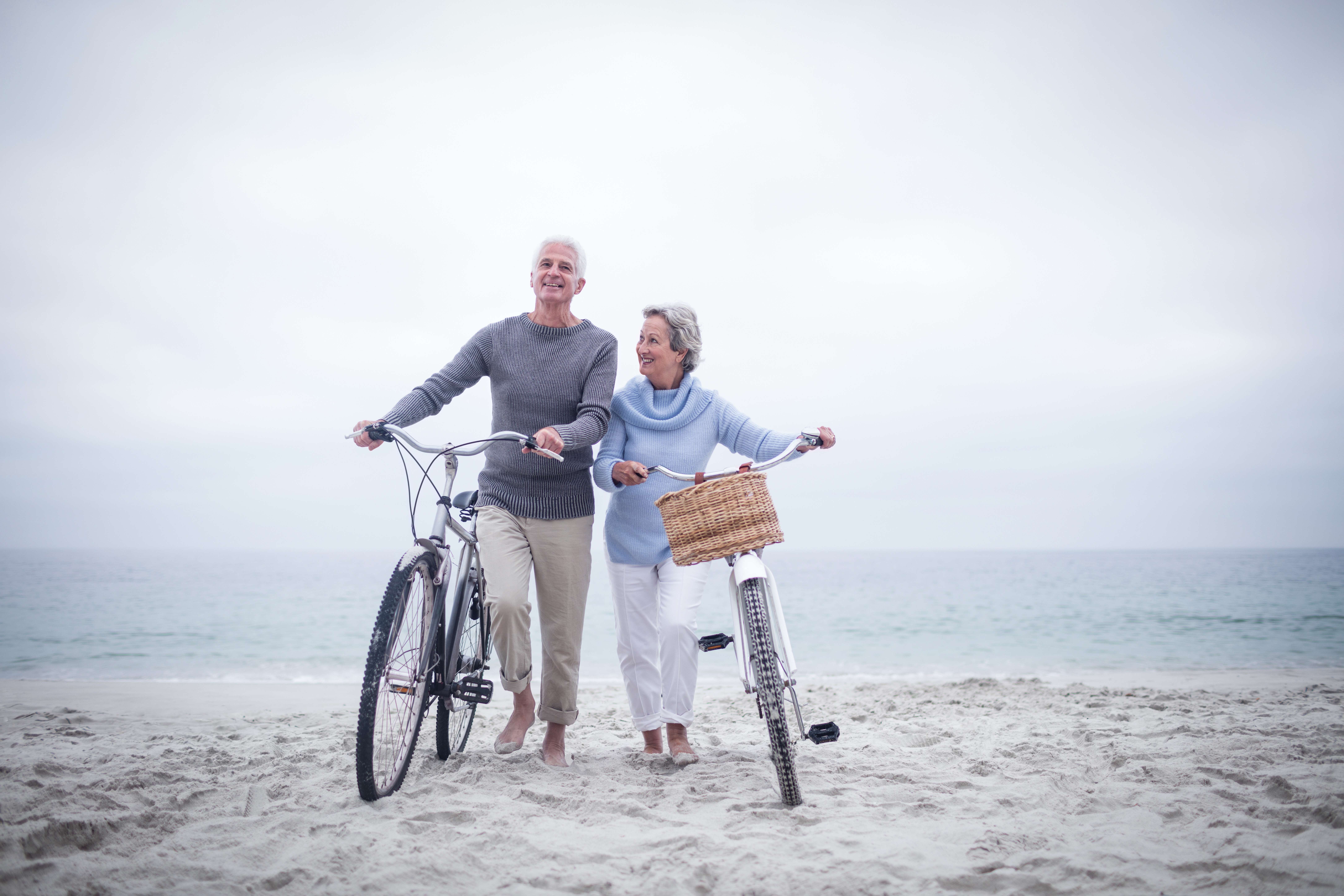 Senior couple having ride with their bike