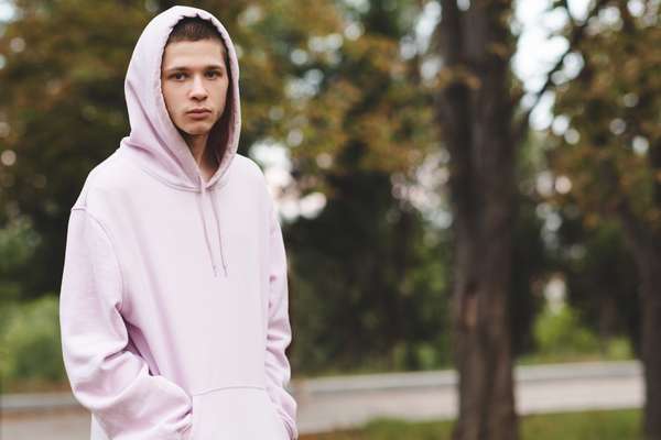 a teen boy in a hoodie