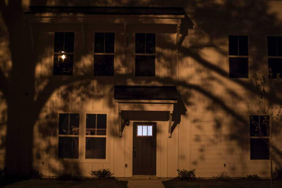 A white house at night in the dark creepy scary house