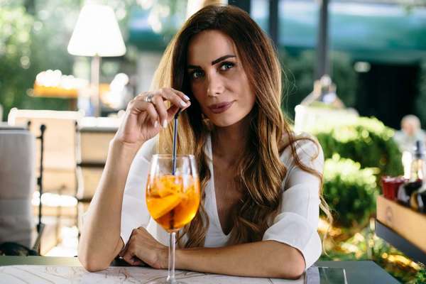 a woman with a cocktail