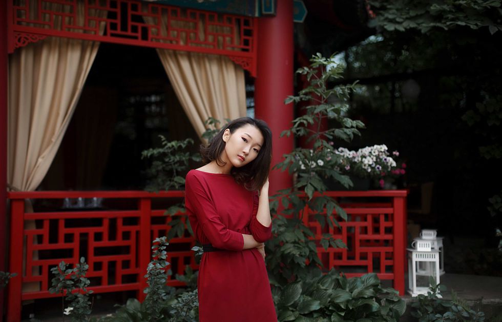 asian woman in red dress