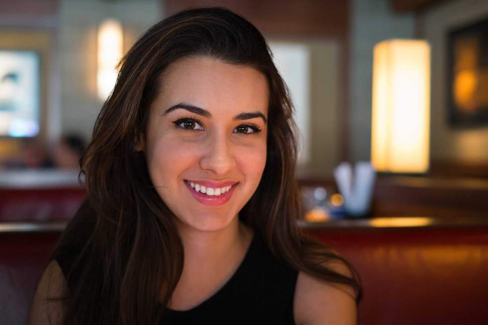 Beautiful multicultural young portrait in a restaurant setting.